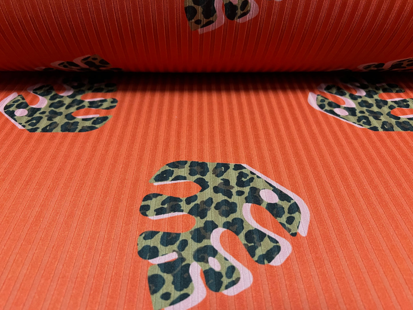 Spandex rib stretch jersey fabric, per metre - safari leaf print - burnt orange