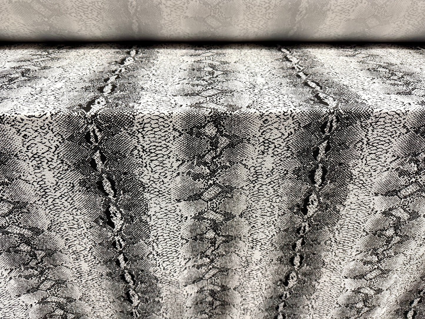 Waterfall textured scuba stretch double jersey fabric, per metre - snake skin print - black & ivory