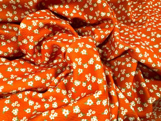 Waterfall textured scuba stretch spandex jersey fabric, per metre - ditsy flower print - orange