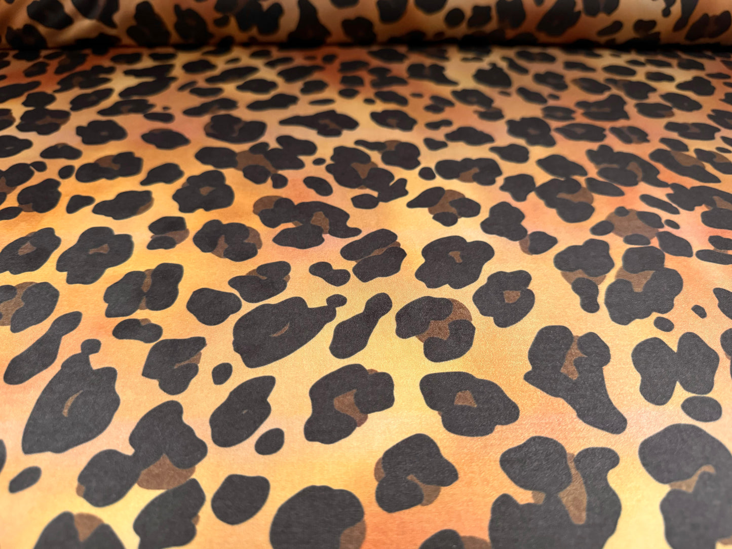 Soft touch stretch spandex single jersey fabric, per metre - stylised leopard print - gold & amber