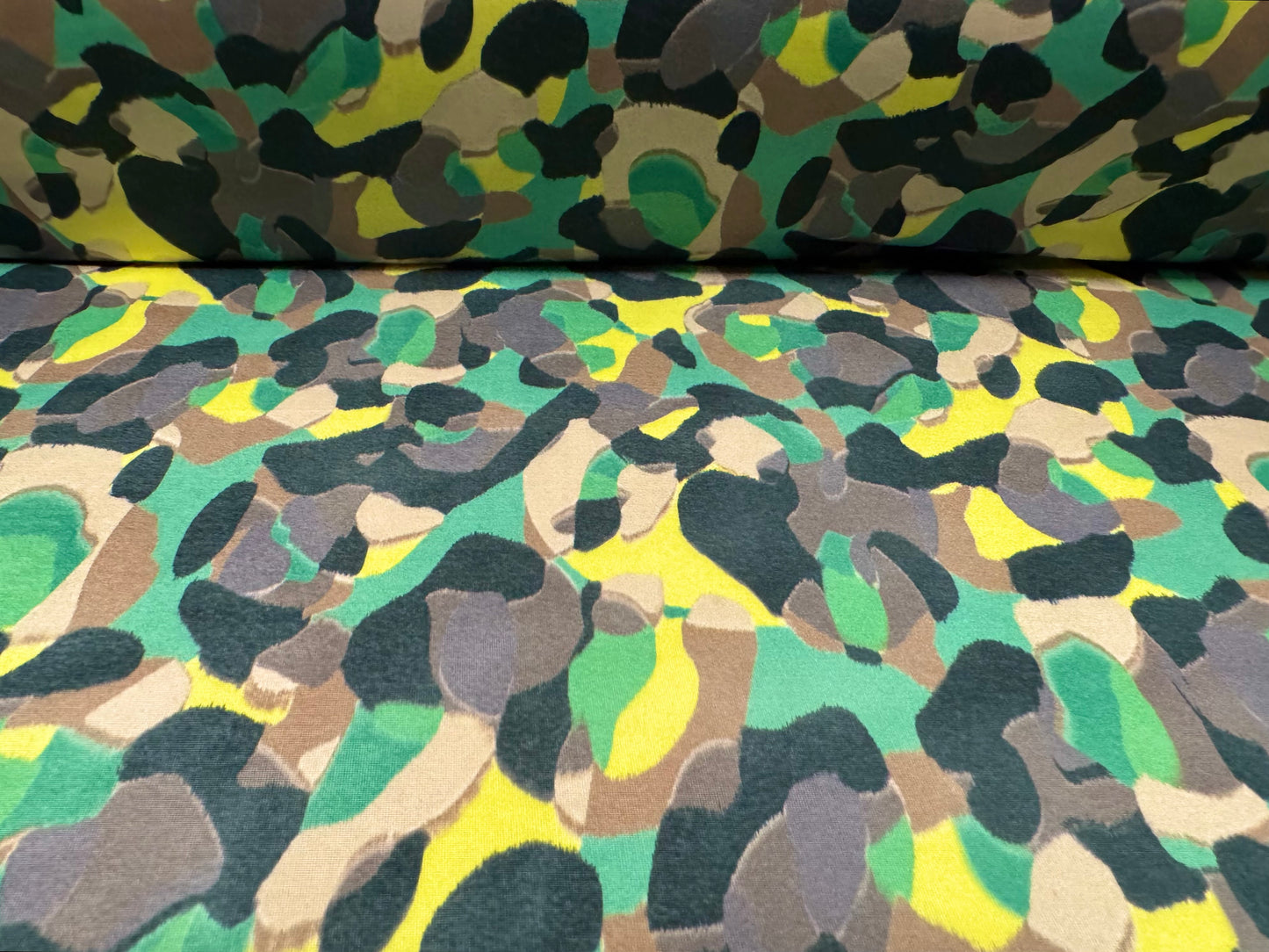 Soft touch stretch spandex single jersey fabric, per metre - stylised animal print - green & yellow
