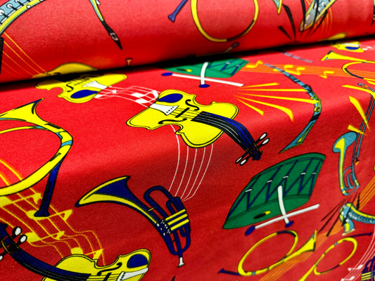 Woven Panama fashion fabric, per metre - musical instruments print - red