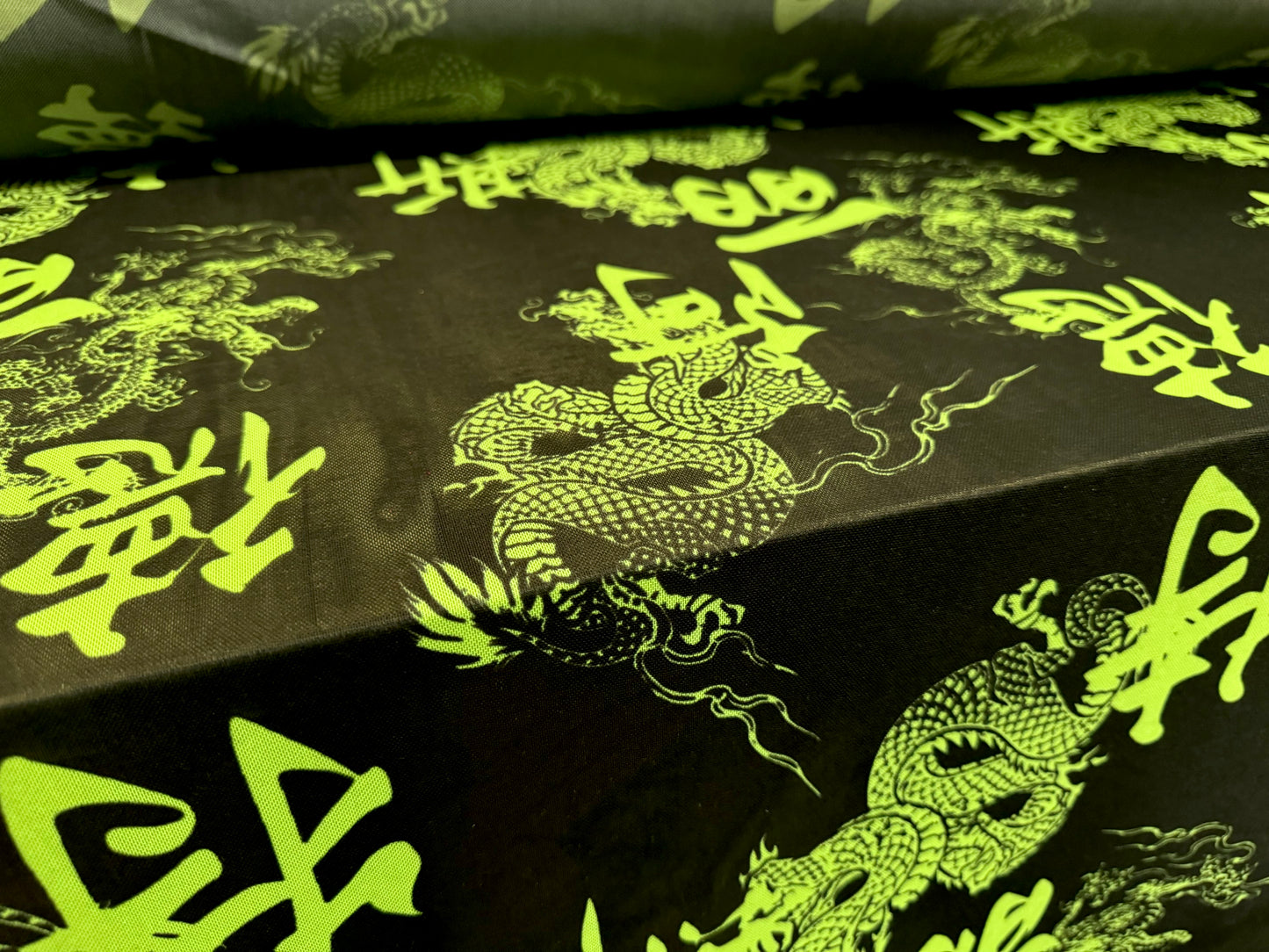 Power mesh net stretch spandex fabric, per metre - Year of the Dragon - black & green