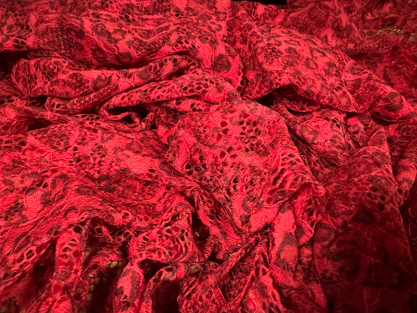 Stretch lace dress fabric with scalloped selvedge, per metre - animal print - red & black