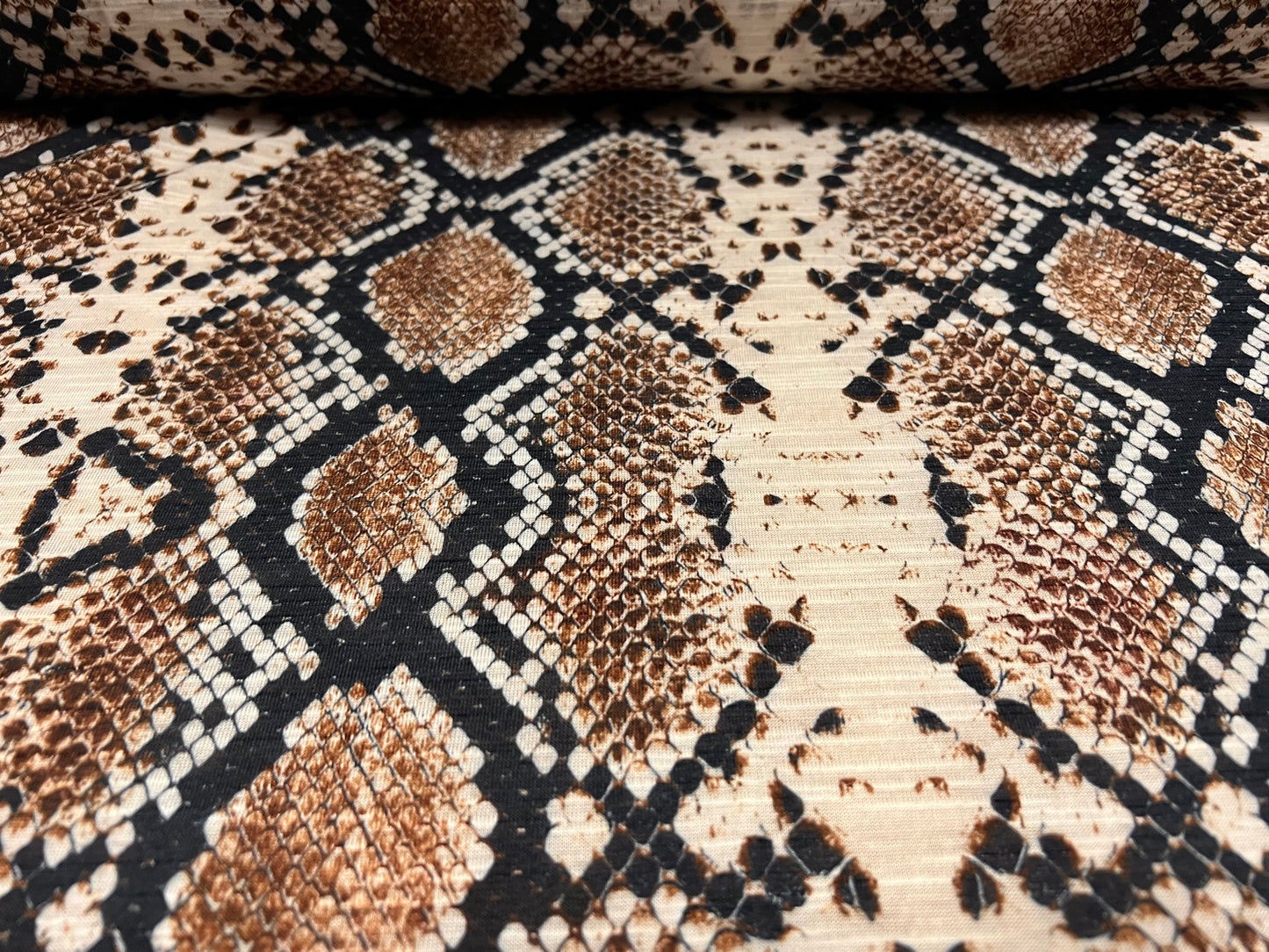 Soft handle lightweight single jersey fabric, per metre - snakeskin animal print - brown