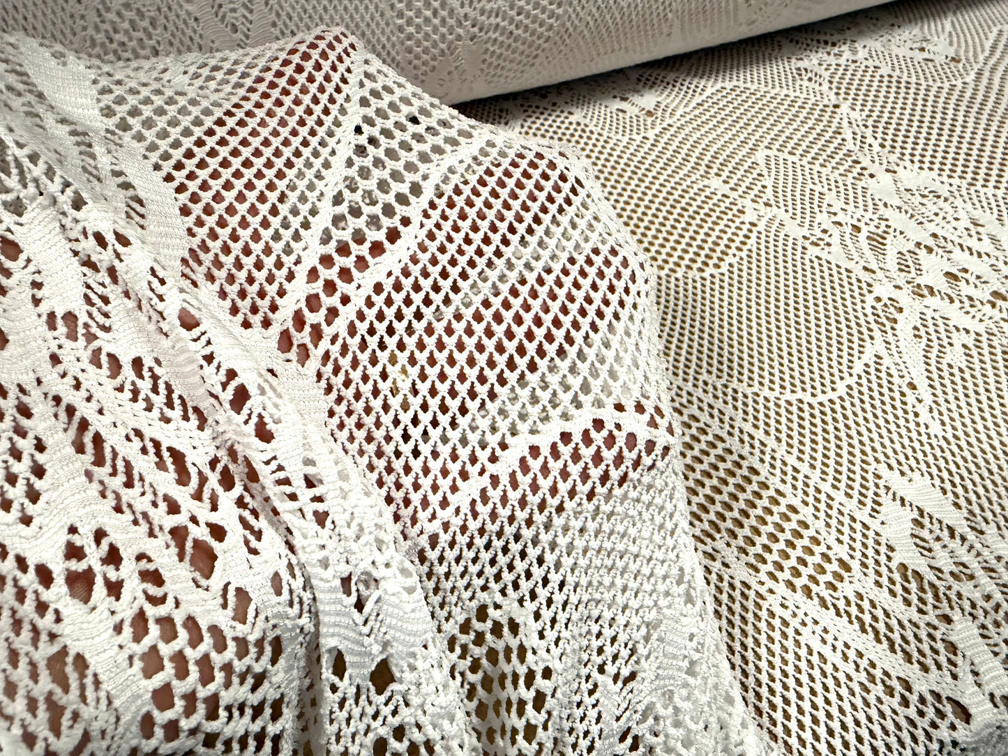 Stretch fishnet jersey fabric with floral design, per metre - white