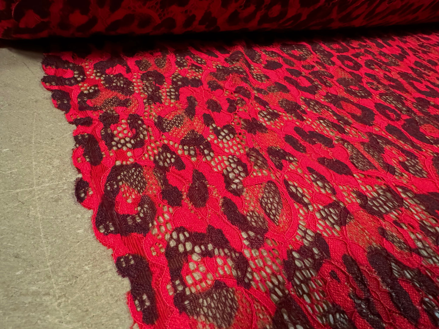 Stretch lace dress fabric with scalloped selvedge, per metre - cheetah animal print - red & brown