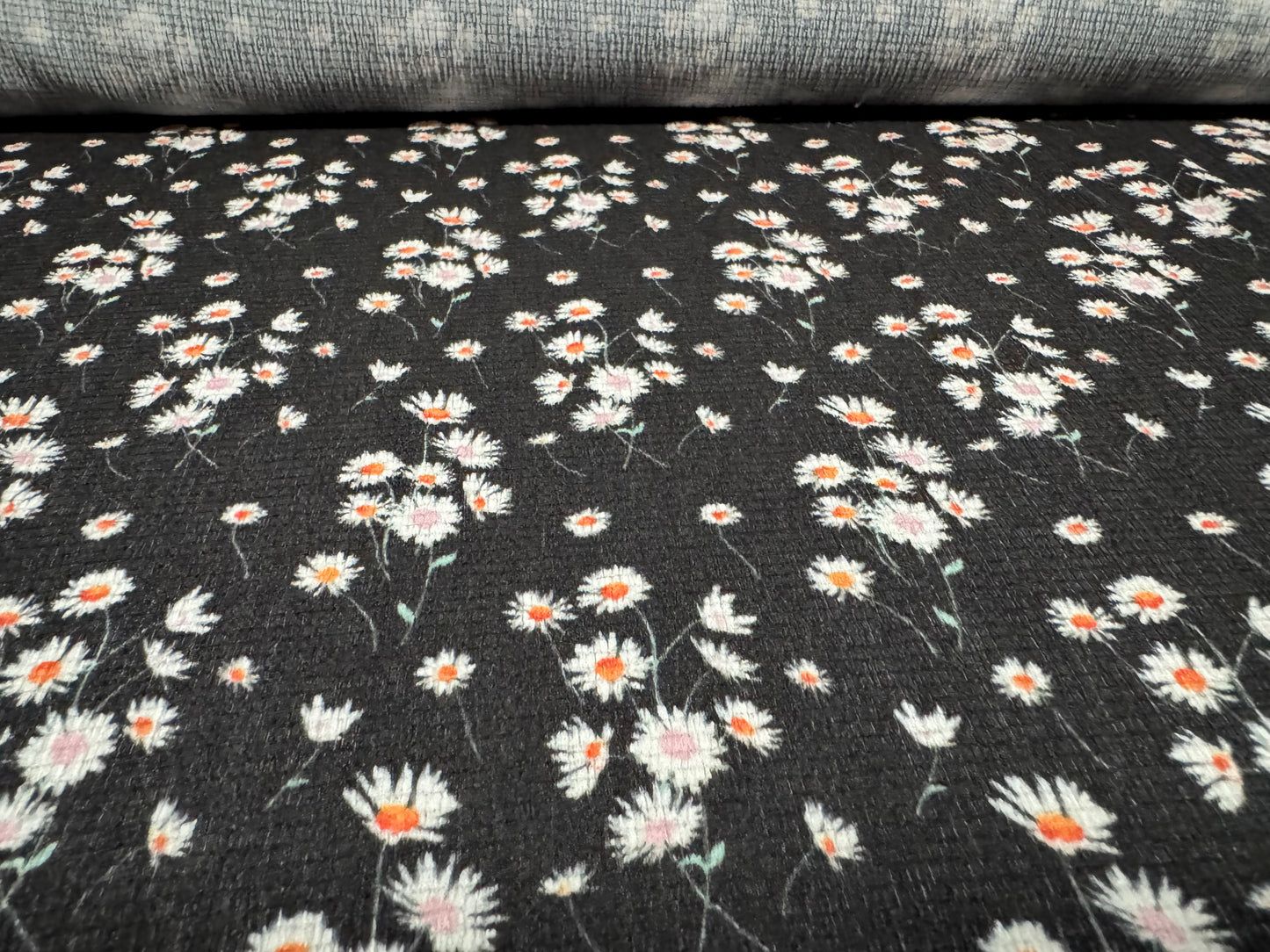 Stretch cheesecloth weave fabric, per metre - ditsy daisy flower print - black white & orange