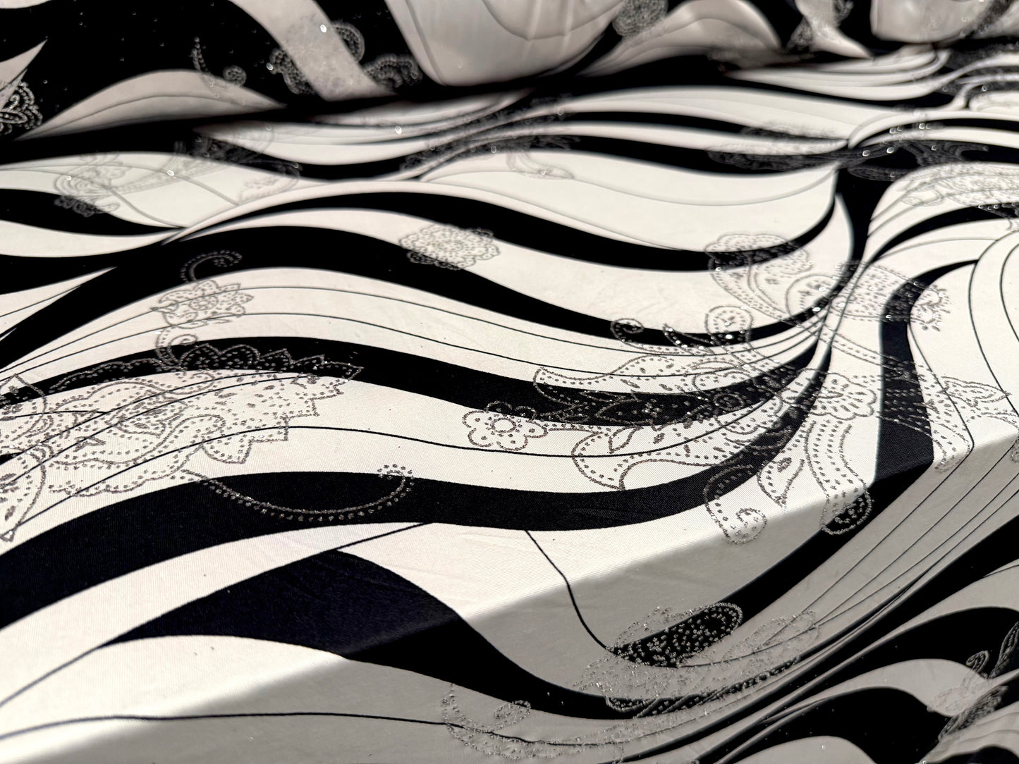 Metallic stretch single jersey fabric, per metre - wave print with paisley glitter- black ivory & silver