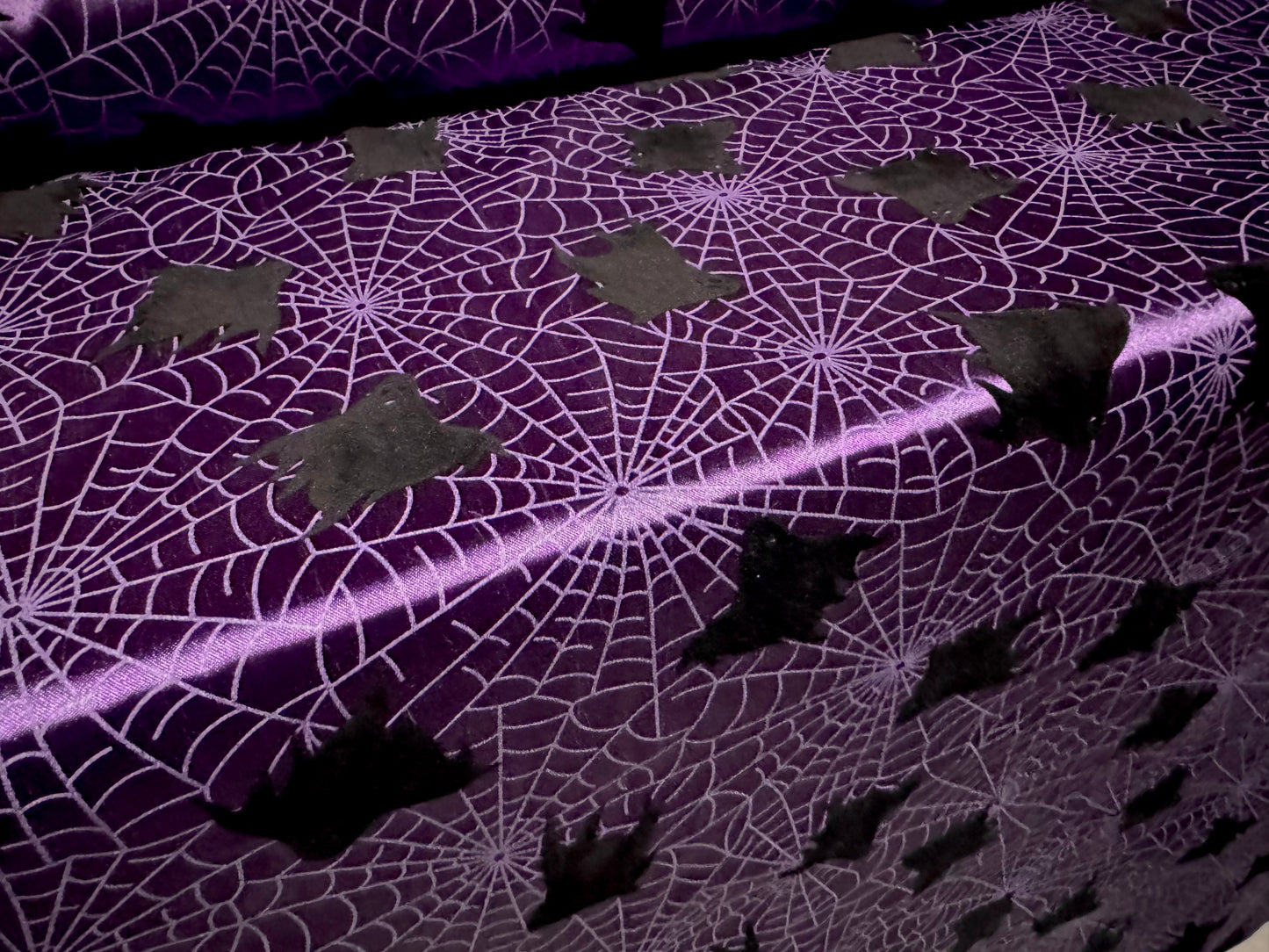 Satin woven dress fabric, per metre - flocked bats & cobwebs Halloween print - purple & black