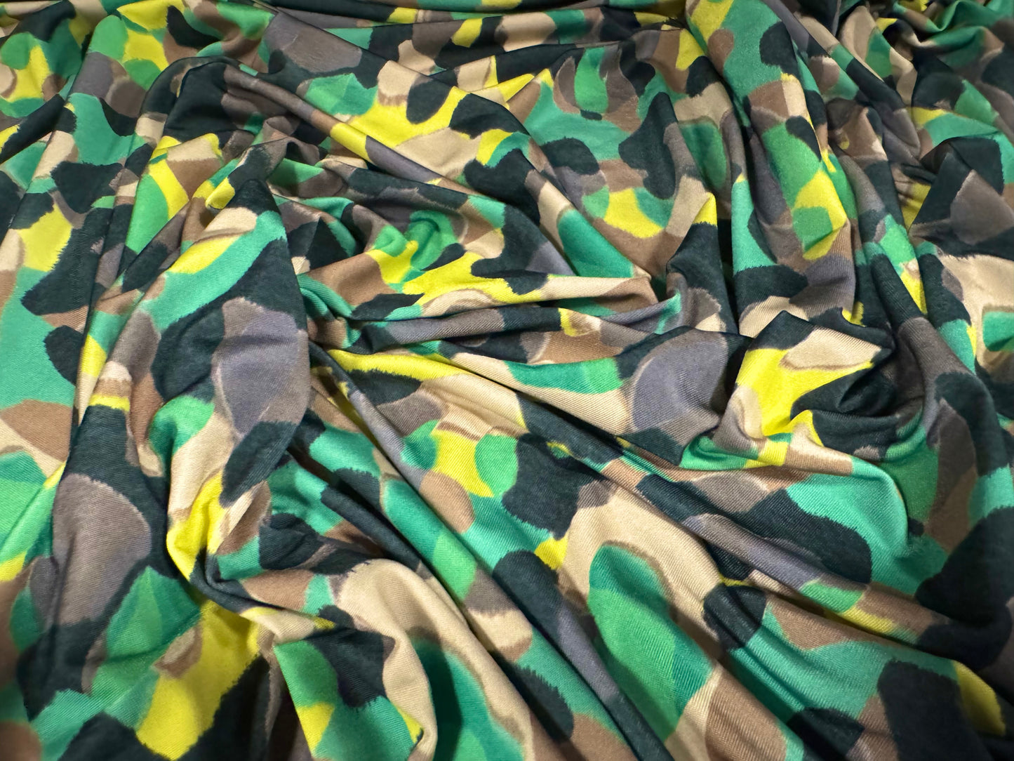 Soft touch stretch spandex single jersey fabric, per metre - stylised animal print - green & yellow
