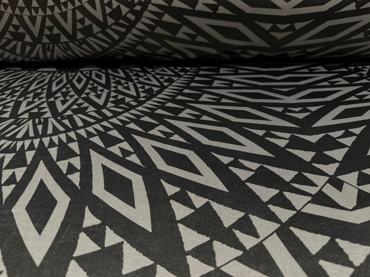 Ciré p.u. coated stretch single jersey fabric, per metre - tribal tattoo print - grey & black