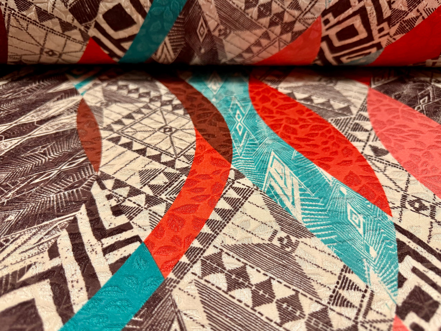Stretch spandex jersey jacquard fabric, per metre - geometric swirl print - nude orange brown & turquoise