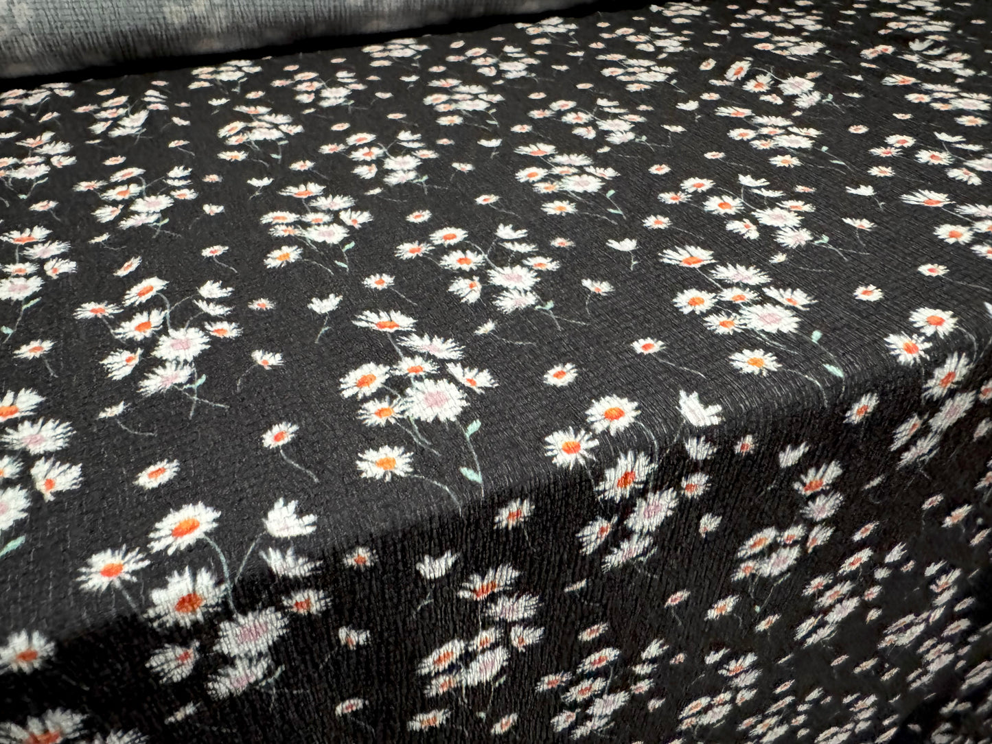 Stretch cheesecloth weave fabric, per metre - ditsy daisy flower print - black white & orange