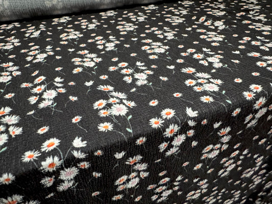 Stretch cheesecloth weave fabric, per metre - ditsy daisy flower print - black white & orange