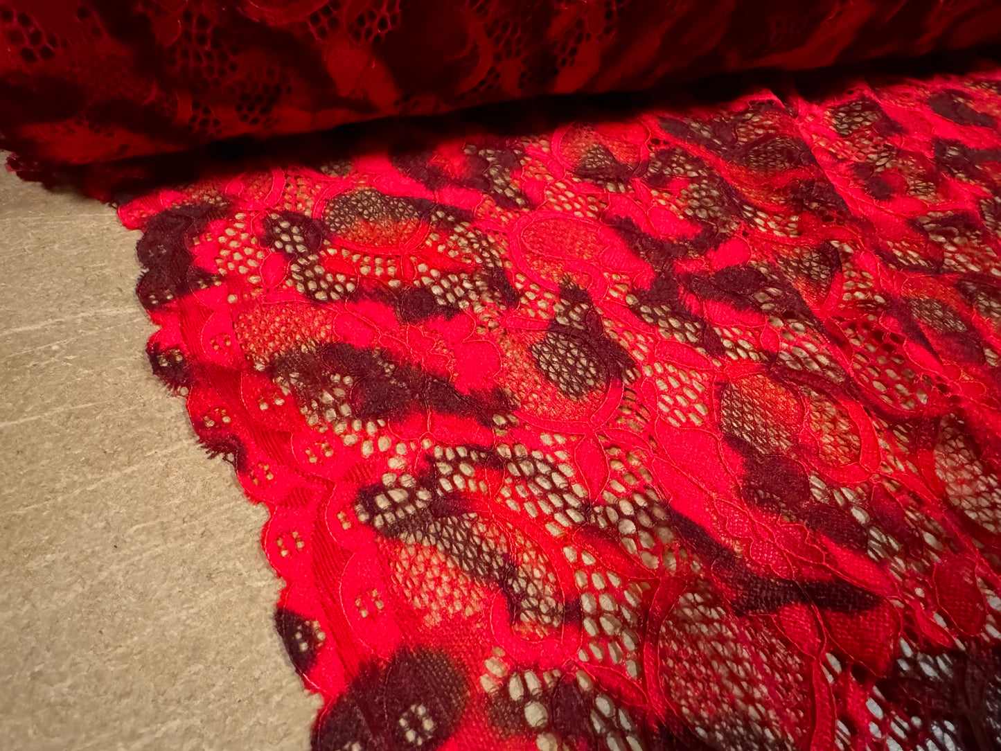 Stretch lace dress fabric with scalloped selvedge, per metre - leopard animal print - red & black