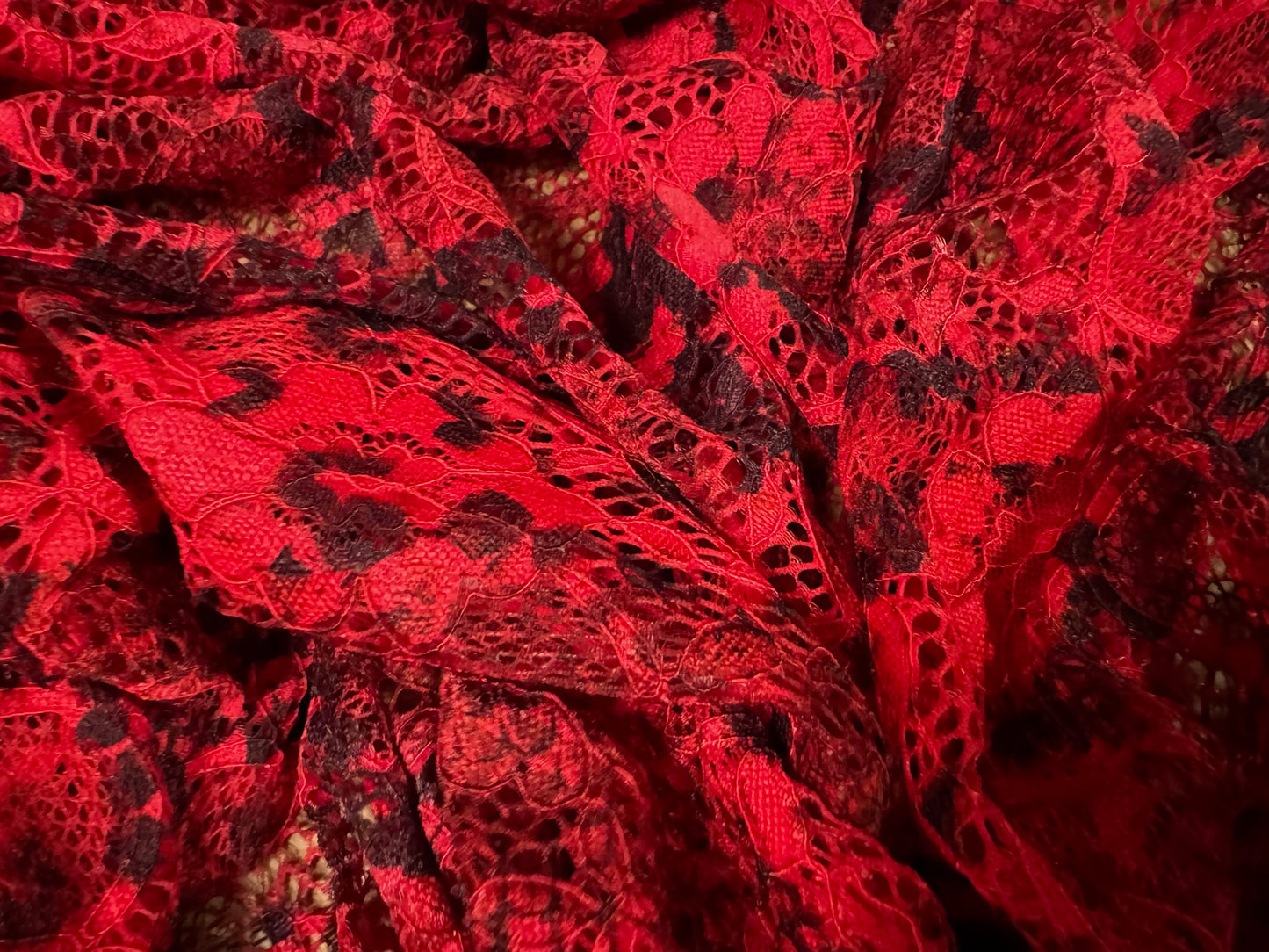 Stretch lace dress fabric with scalloped selvedge, per metre - snakeskin animal print - red & black