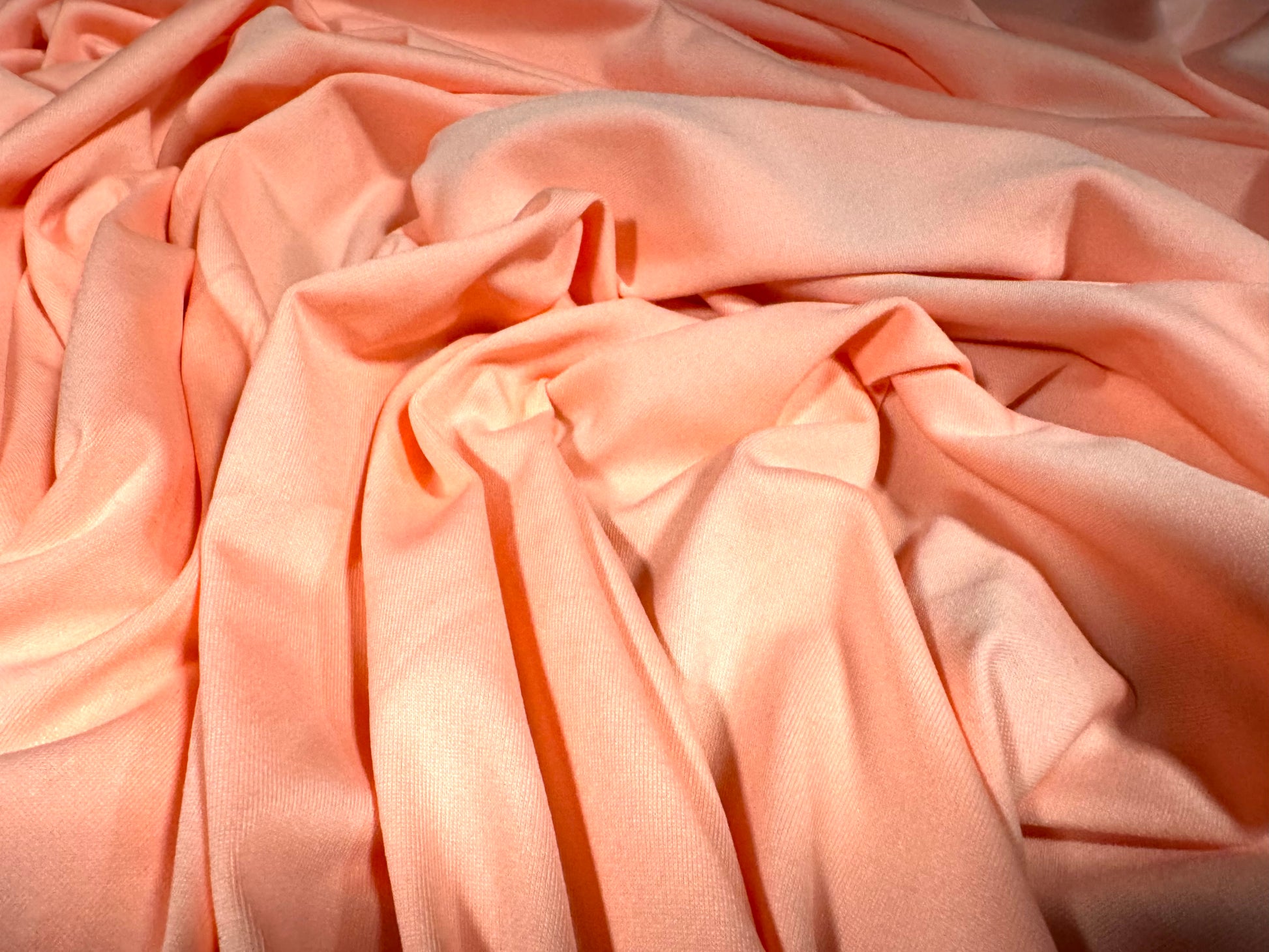 Soft touch spandex stretch jersey dress fabric, per metre - plain - fluorescent peach Soft touch spandex stretch jersey dress fabric, per metre - plain - fluorescent peach