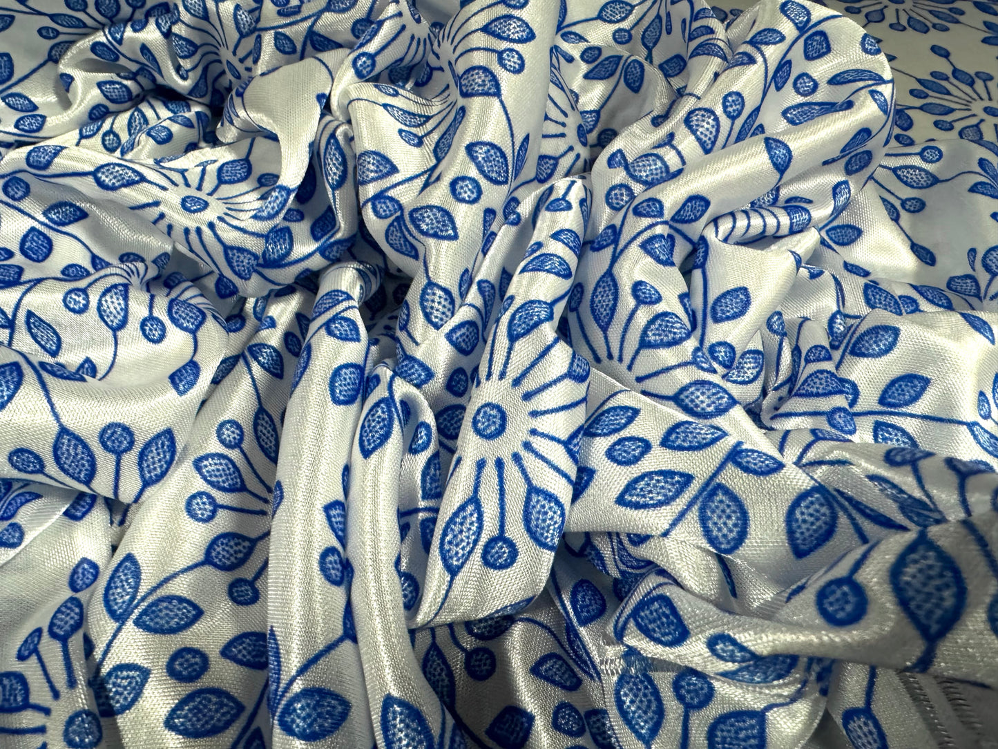 Stretch satin jersey fabric, per metre - stylised flower print - white & cobalt blue