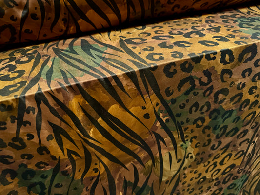 Soft touch stretch spandex single jersey fabric, per metre - stylised animal print - dark honey