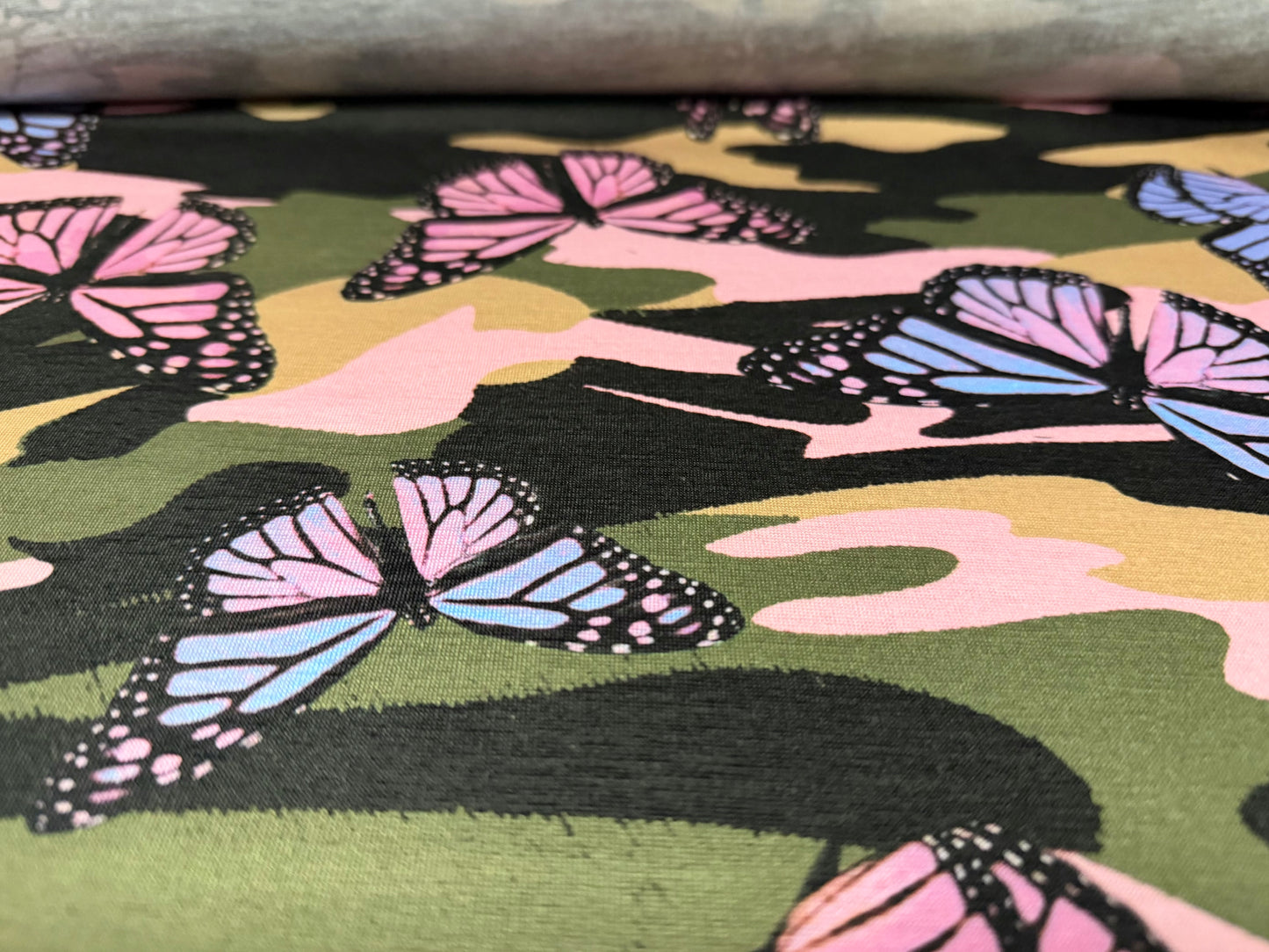 Soft handle stretch jersey fabric, per metre - butterfly camouflage print
