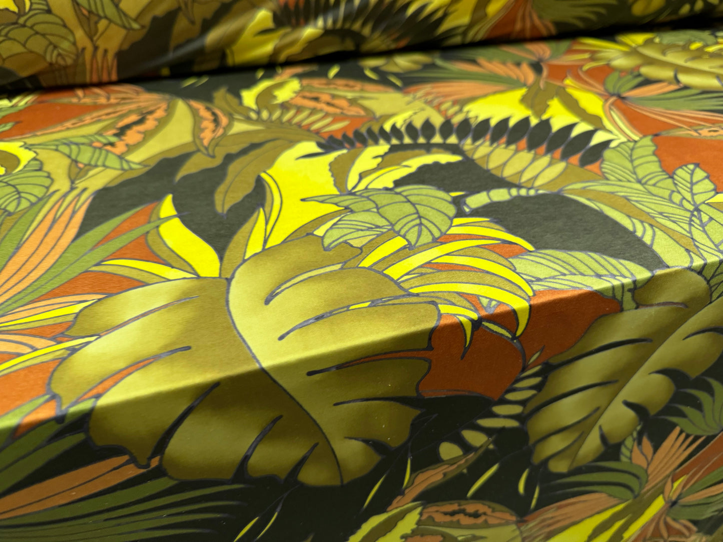 Soft touch stretch spandex single jersey fabric, per metre - jungle leaves print - green & rust