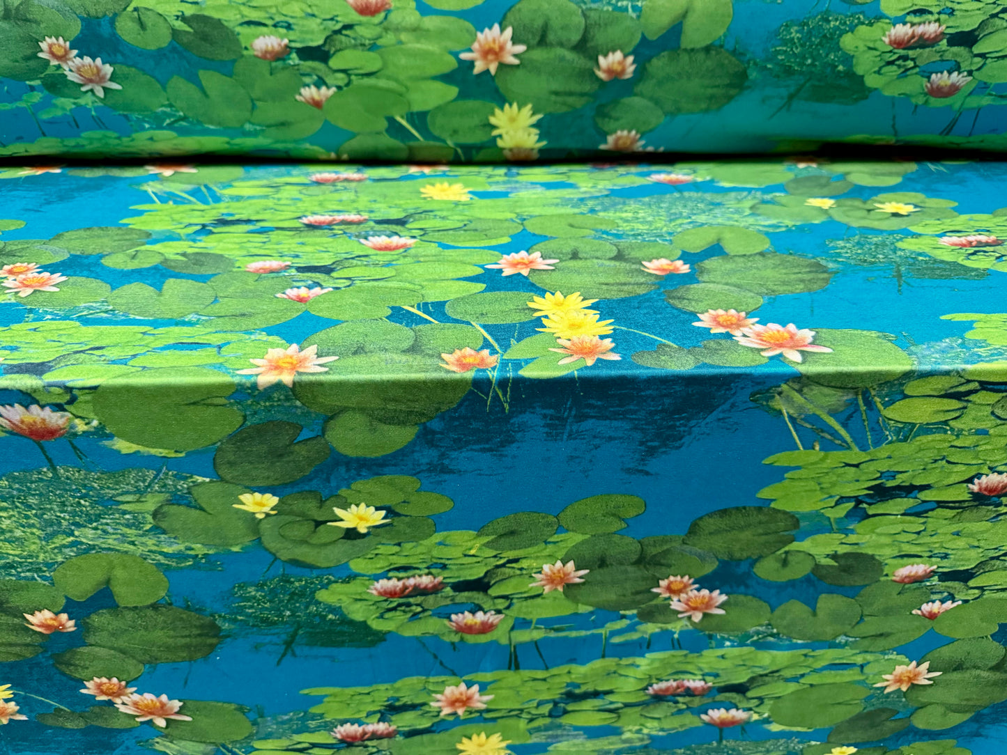 Soft touch stretch spandex single jersey fabric, per metre - water lily print - blue & green