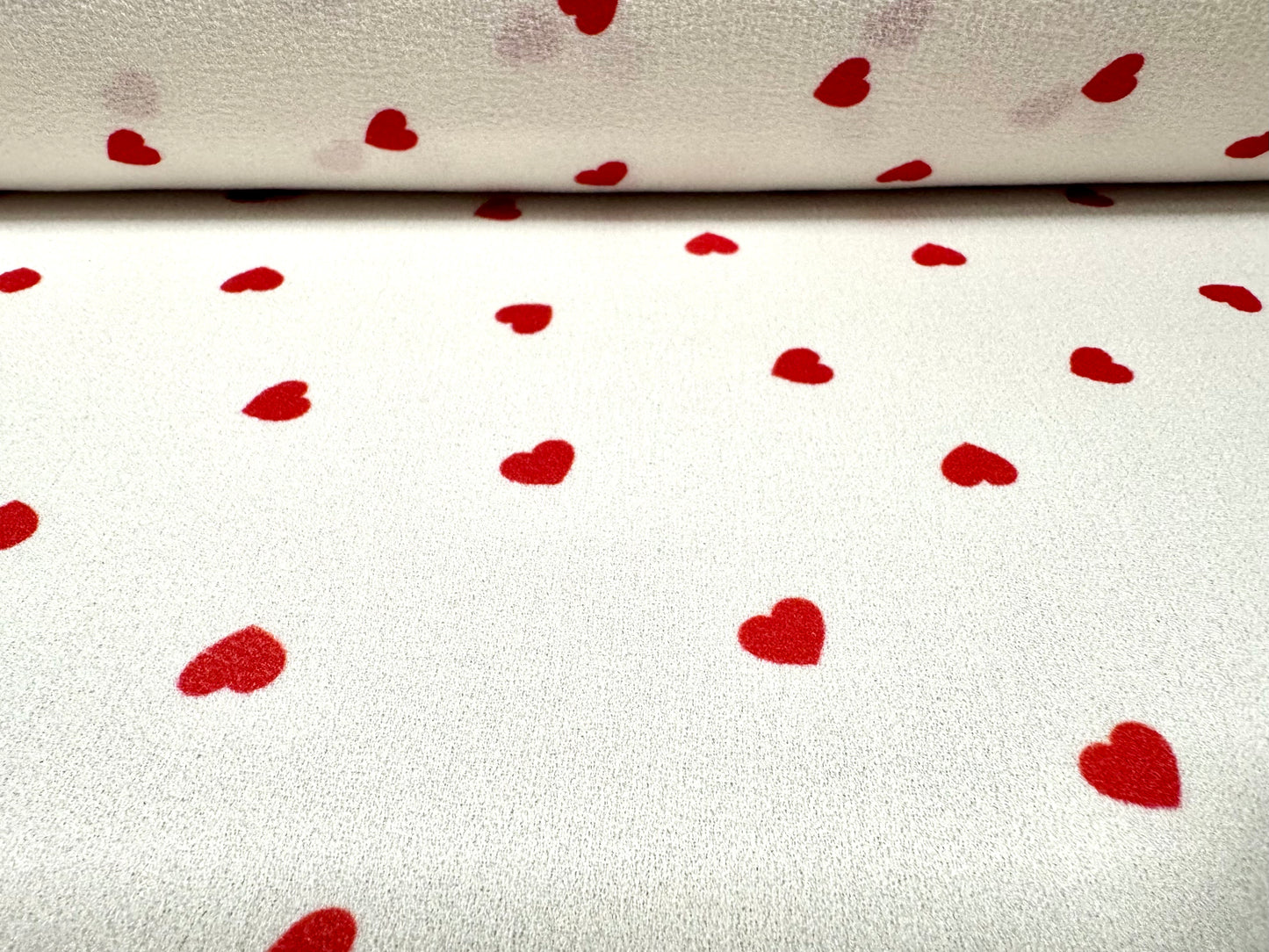 Bubble crepe woven dress fabric with comfort stretch, per metre - love heart print - ivory & red