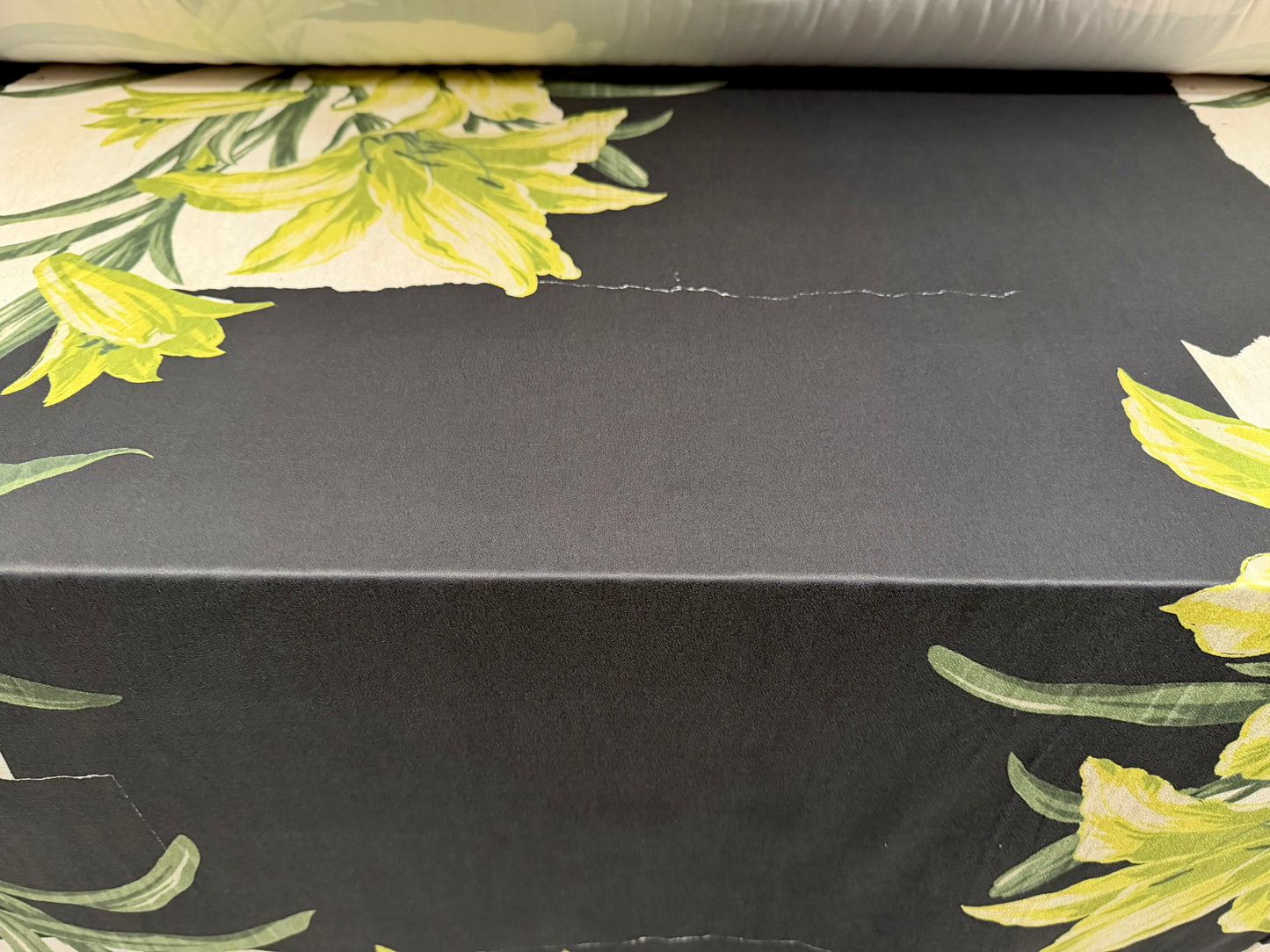 Super soft stretch single jersey fabric, per metre - lily floral print - black cream & green
