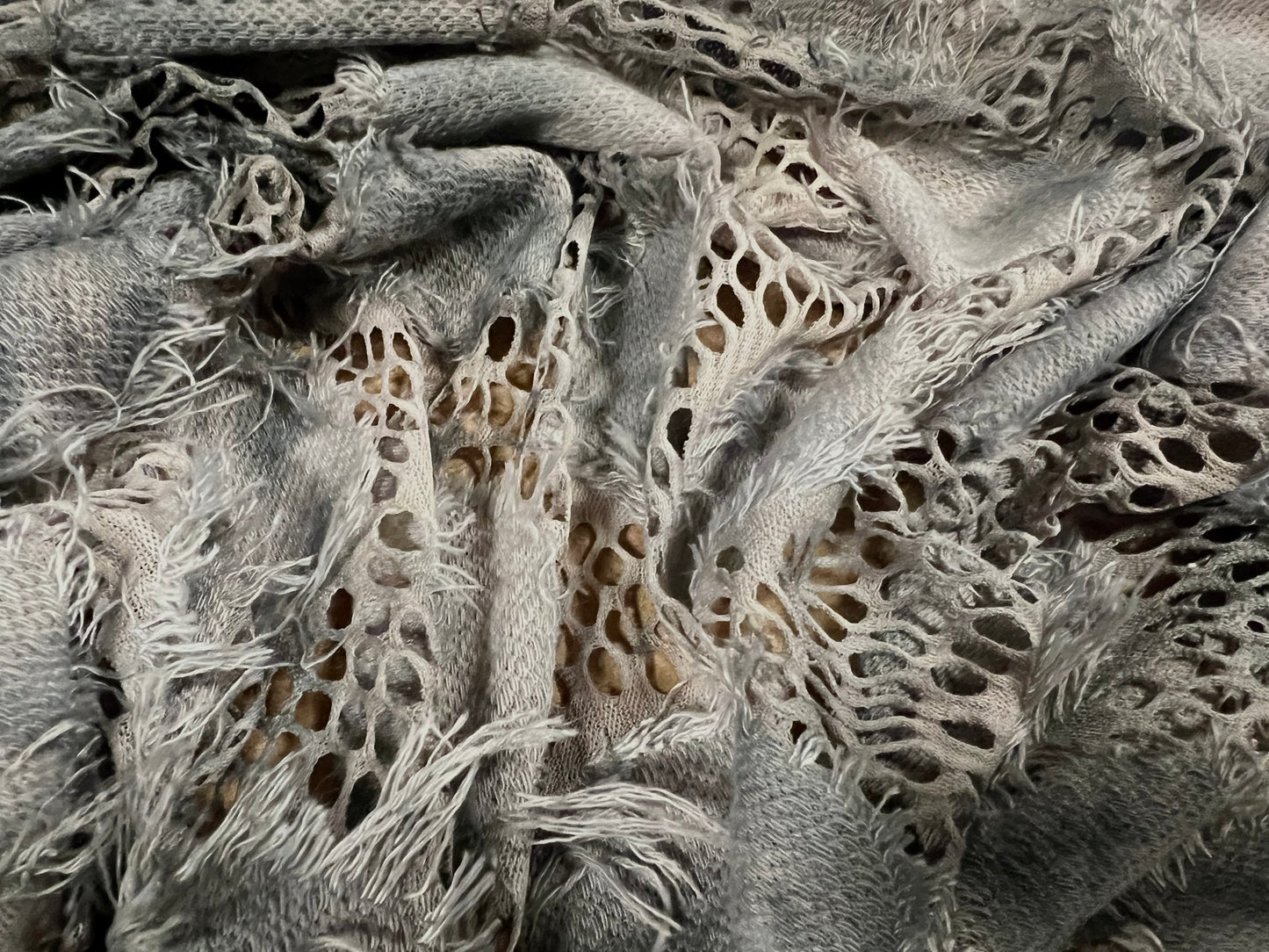 Couture fishnet lace dress fabric with frayed appliqué, per metre - grey