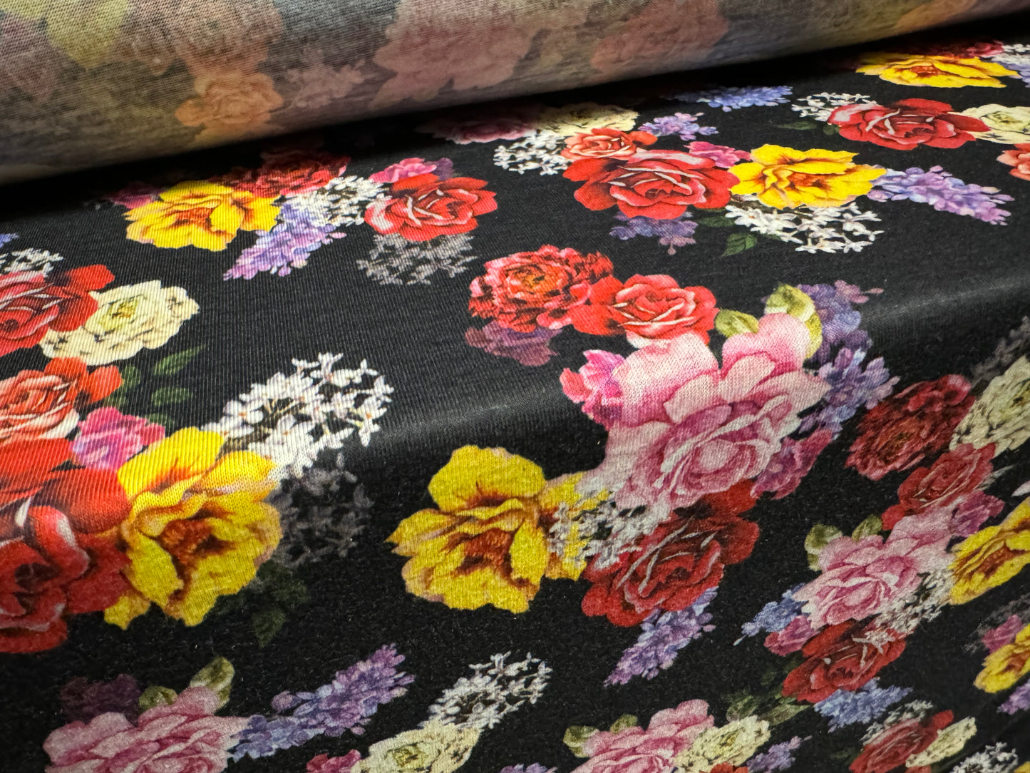 Soft handle single jersey fabric, per metre - roses print - black with multicolour flowers