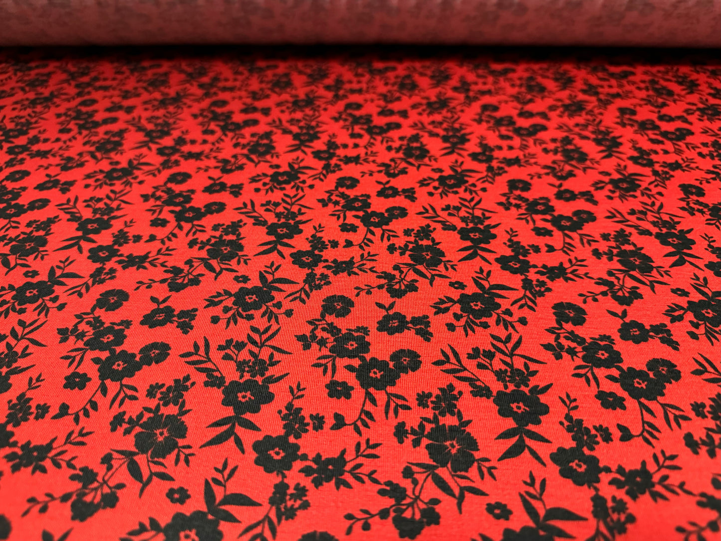 Soft handle stretch single jersey fabric, per metre - ditsy flower print - red & black