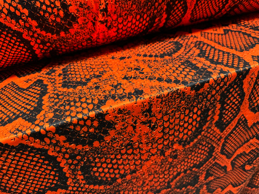 Broderie anglaise stretch spandex jersey fabric, per metre - snakeskin animal print - burnt orange