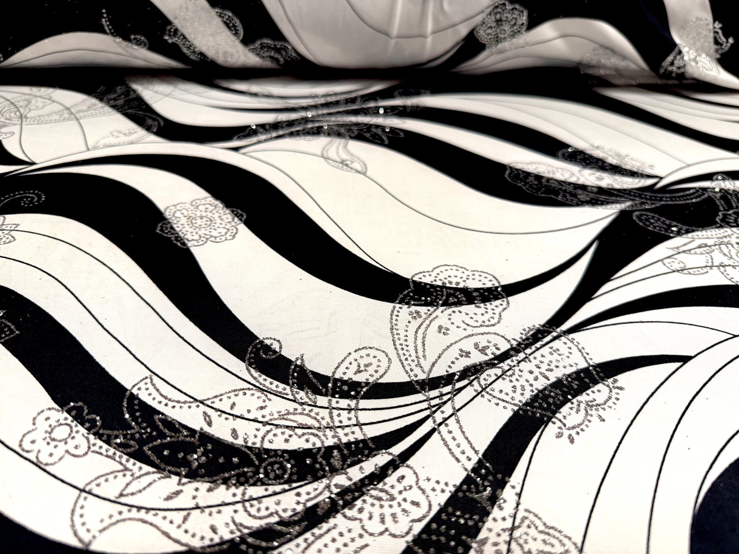 Metallic stretch single jersey fabric, per metre - wave print with paisley glitter- black ivory & silver
