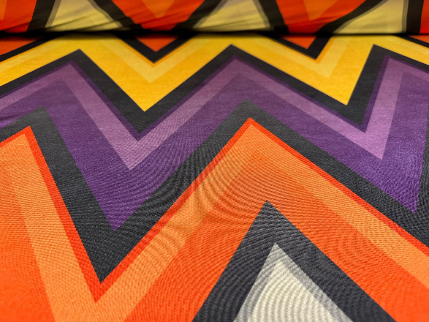 Soft touch stretch spandex single jersey fabric, per metre - jumbo chevron print - orange yellow & purple