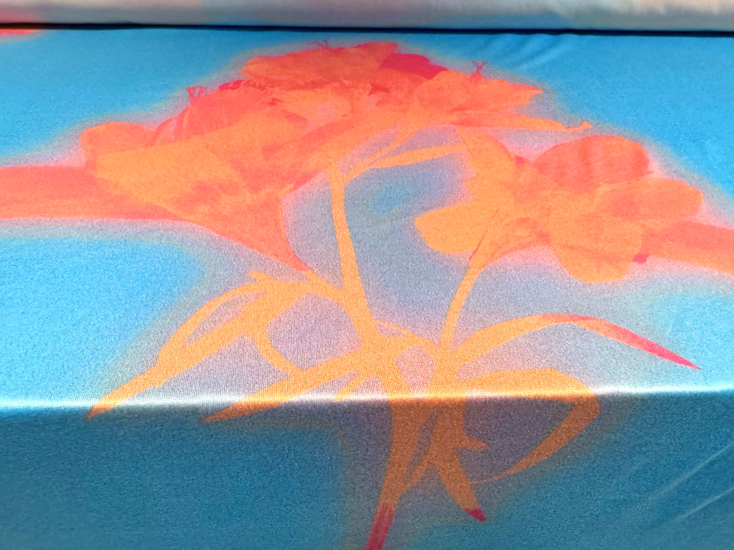 Soft touch stretch spandex single jersey fabric, per metre - stylised flower print - sky blue & orange
