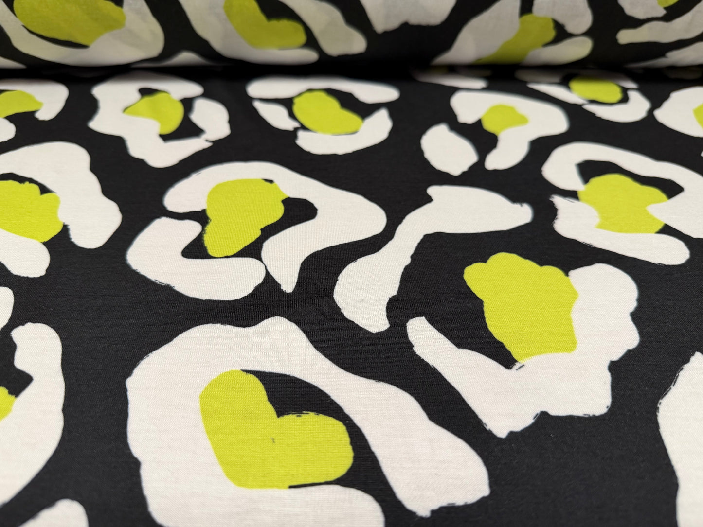 Soft handle stretch single jersey fashion fabric, per metre - animal print - black & lime