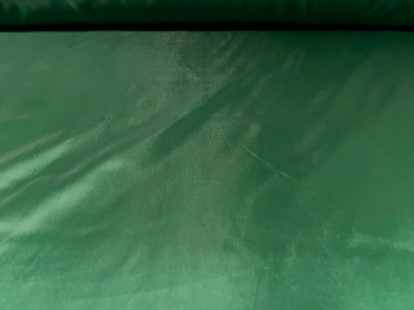 Woven polyester satin lining fabric, per metre - plain - emerald green