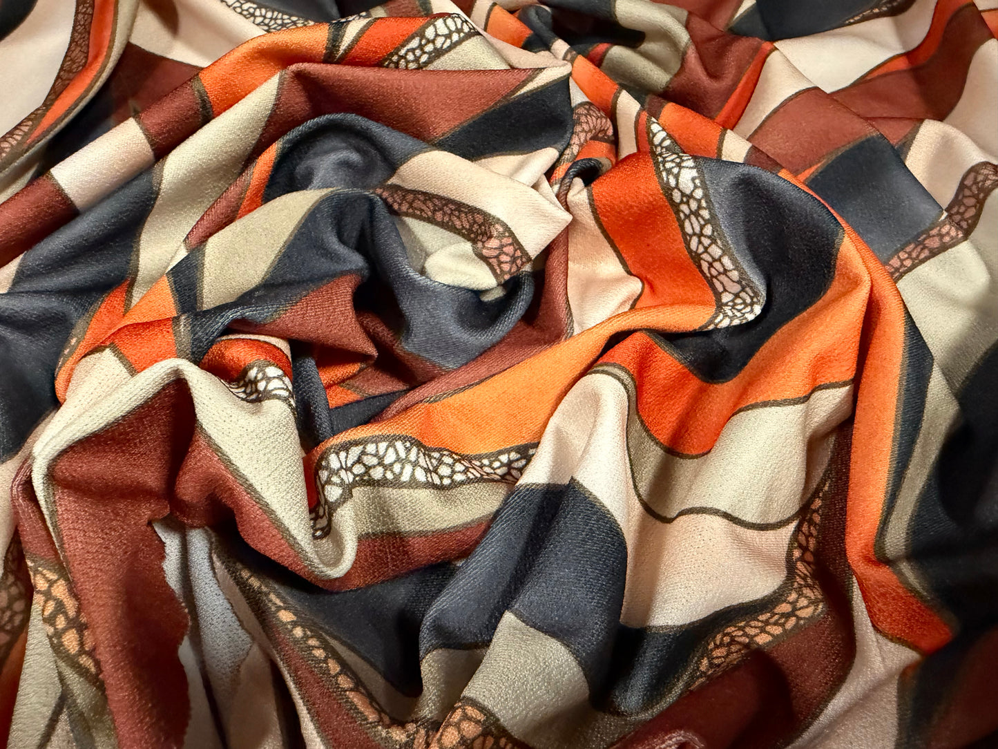 Stretch spandex crepe single jersey dress fabric, per metre - wavy swirl print - cream terracotta & rust
