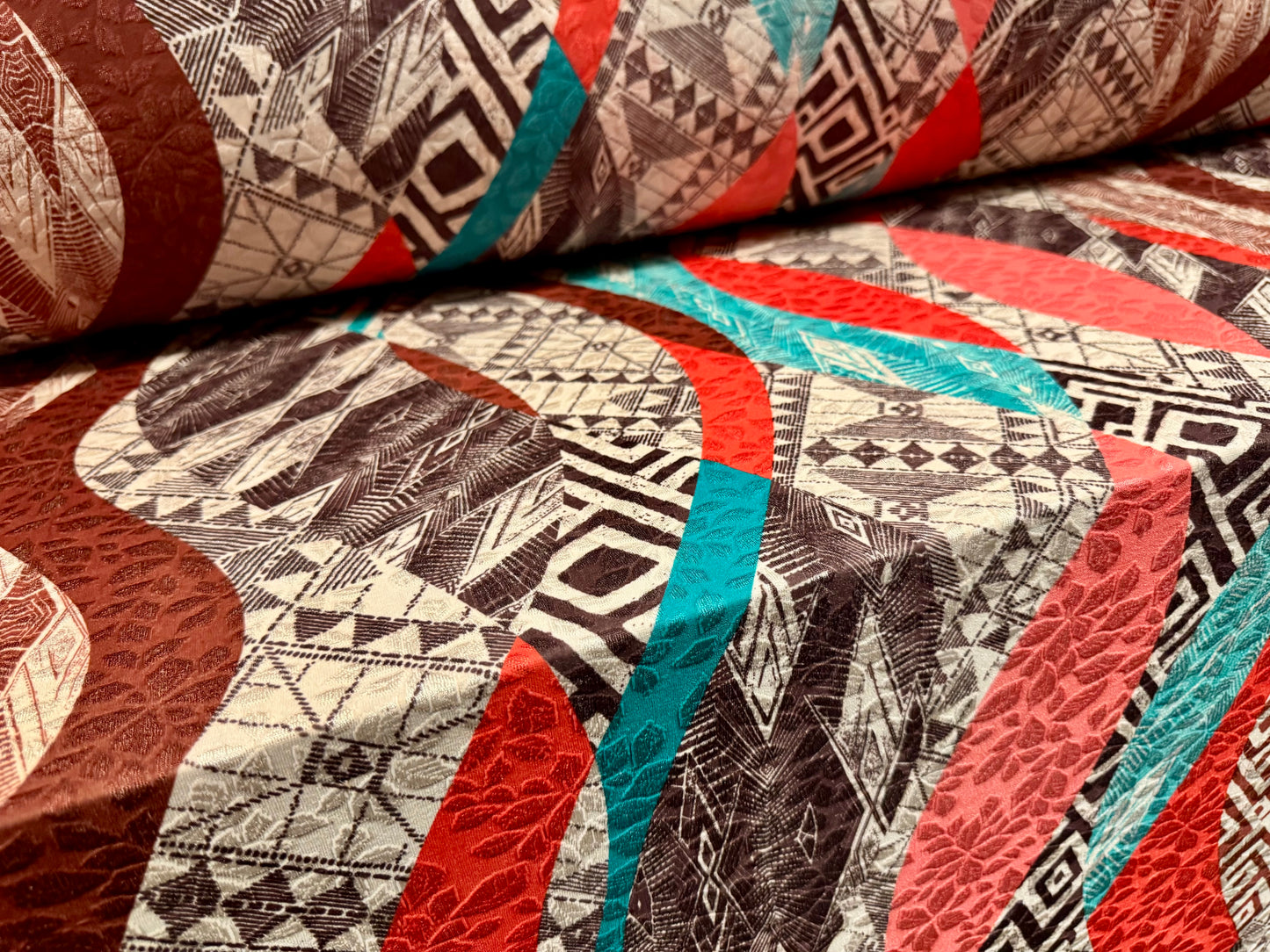 Stretch spandex jersey jacquard fabric, per metre - geometric swirl print - nude orange brown & turquoise