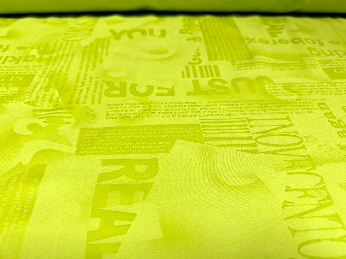 Woven powder touch fashion fabric, per metre - embossed words & letters print - Apple green