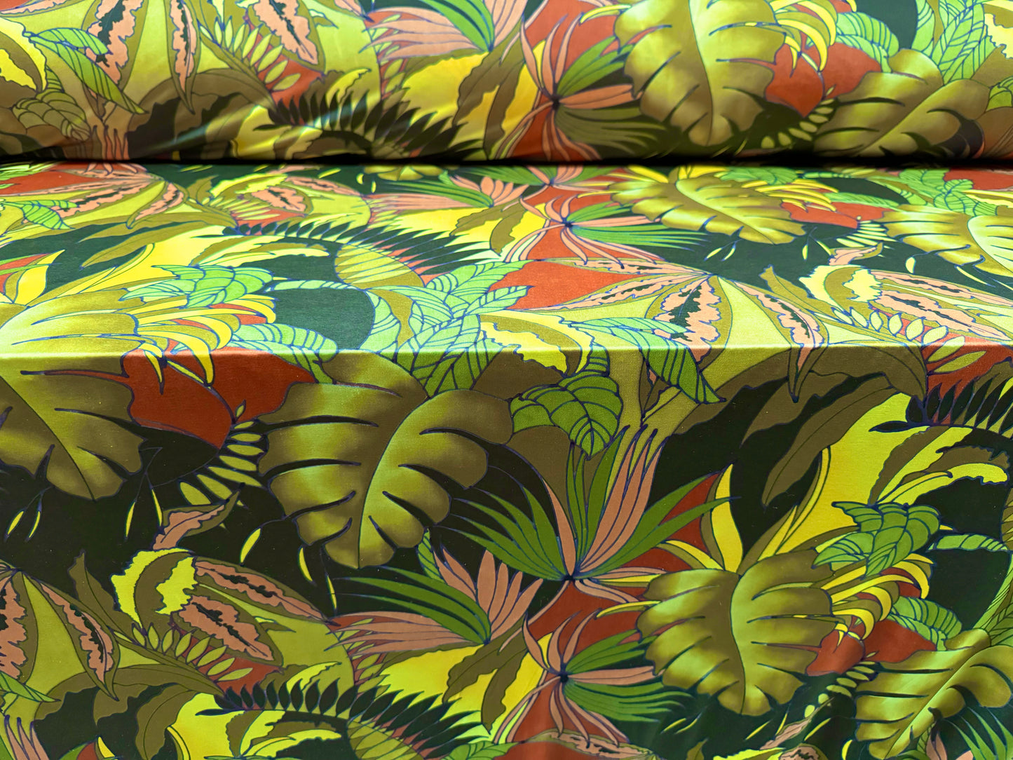 Soft touch stretch spandex single jersey fabric, per metre - jungle leaves print - green & rust