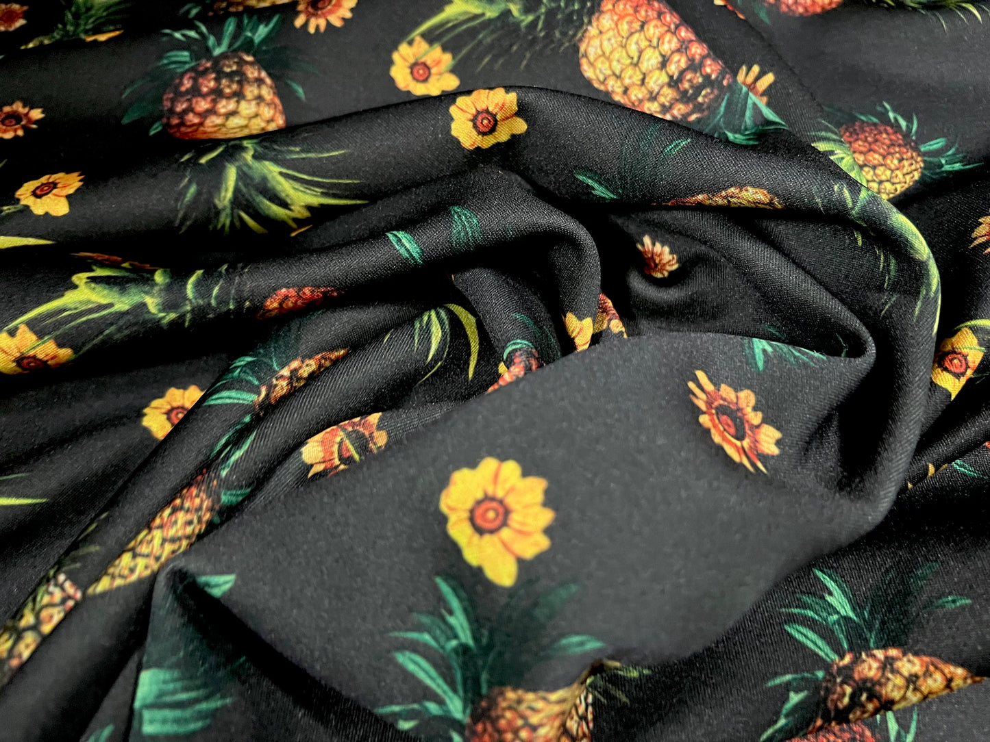 Scuba stretch spandex double jersey dress fabric, per metre - pineapple print - black & amber