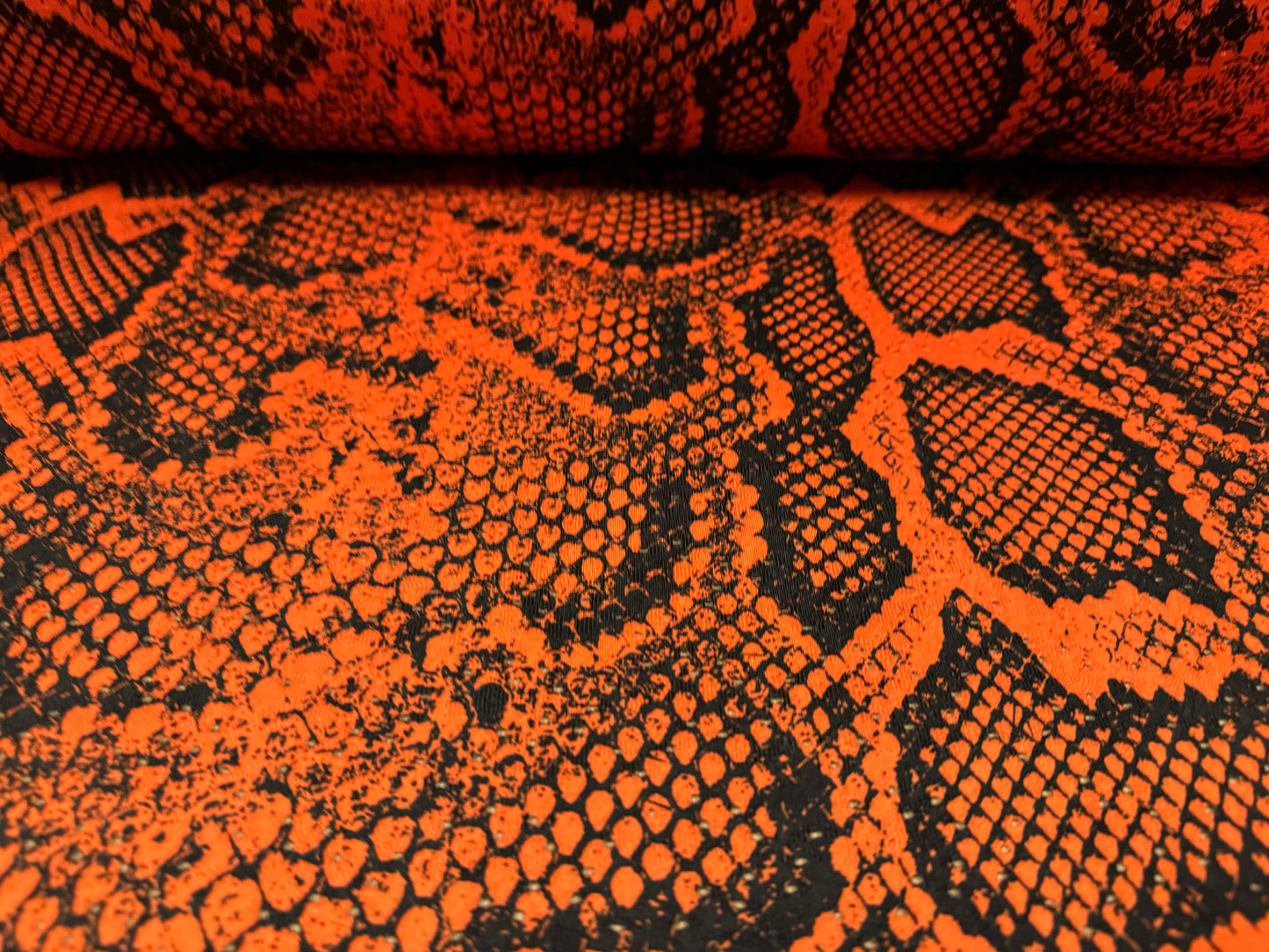 Broderie anglaise stretch spandex jersey fabric, per metre - snakeskin animal print - burnt orange