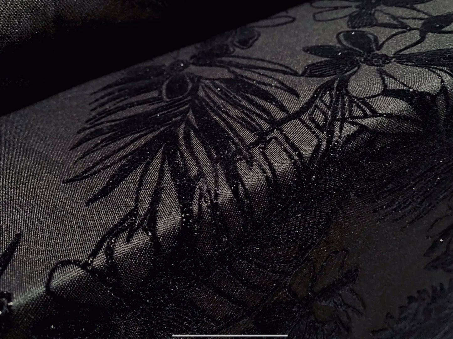 Stretch spandex double jersey fabric, per metre - jungle leaves print with glitter sparkle - black on black