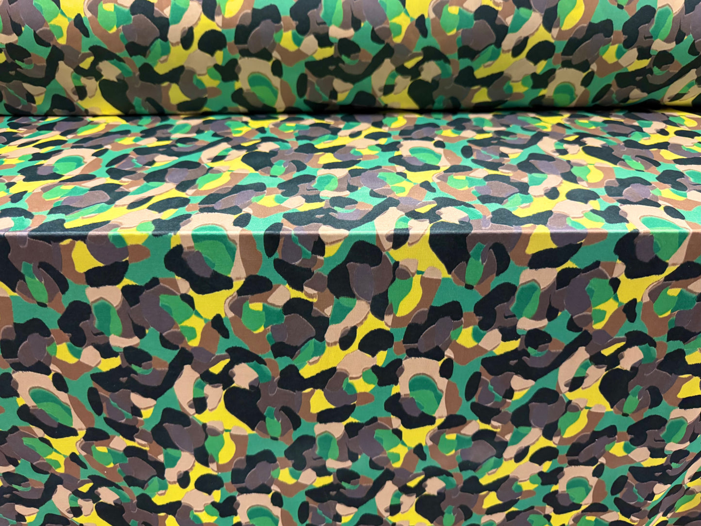 Soft touch stretch spandex single jersey fabric, per metre - stylised animal print - green & yellow