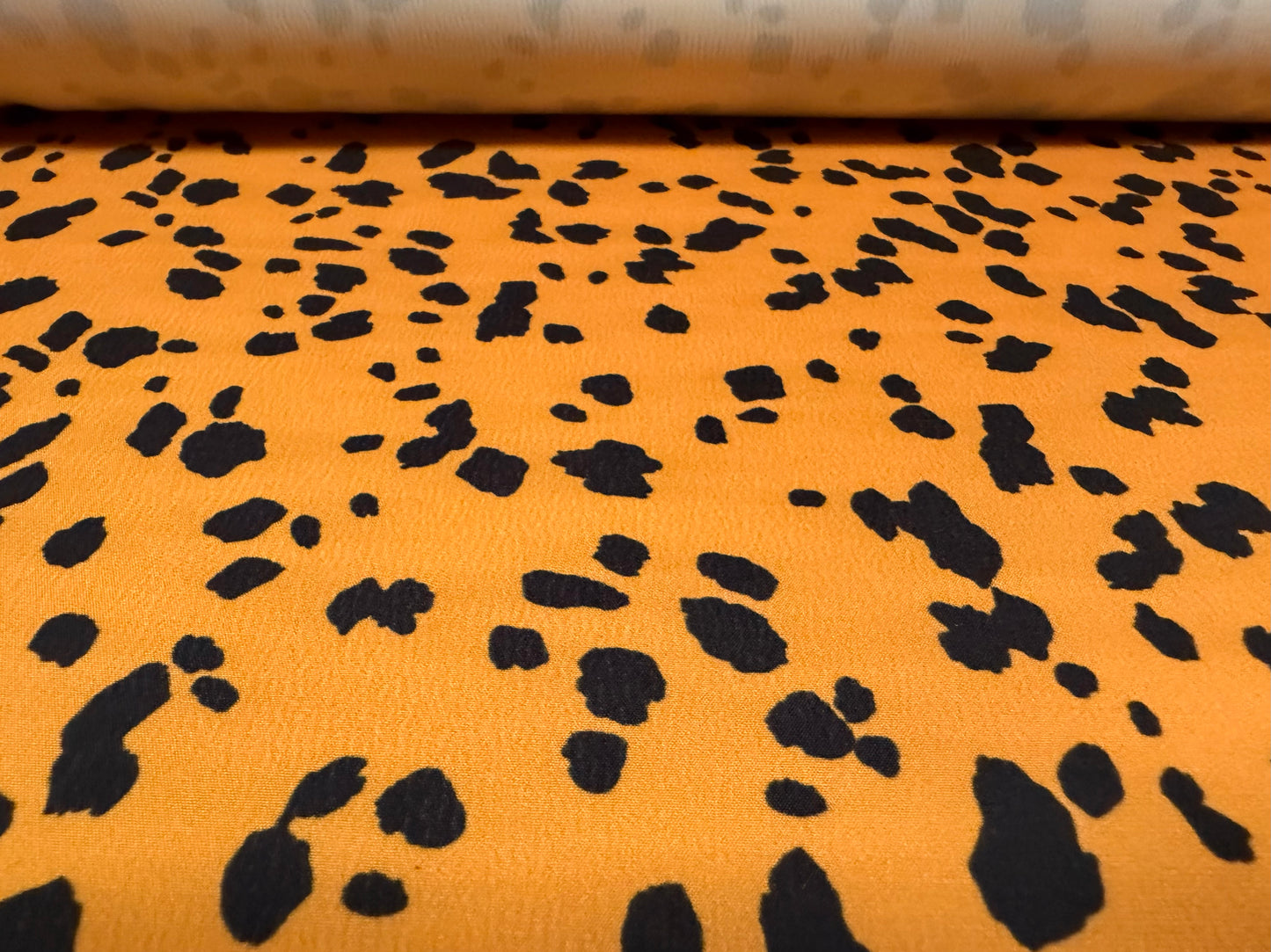 Sateen back crepe woven fashion fabric, per metre - Dalmatian print - honey