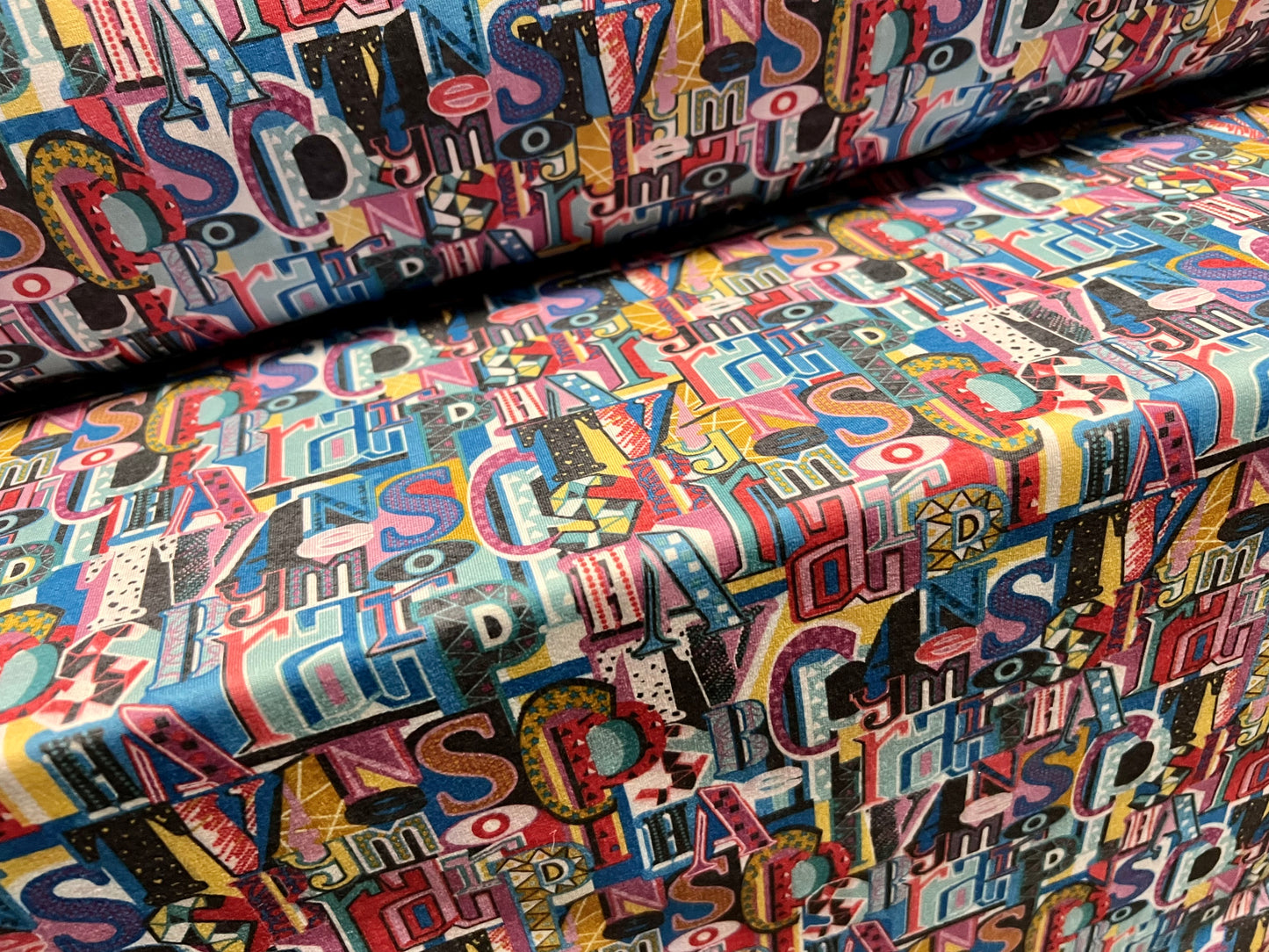 Soft handle single jersey fabric, per metre - funky alphabet print - multicolour