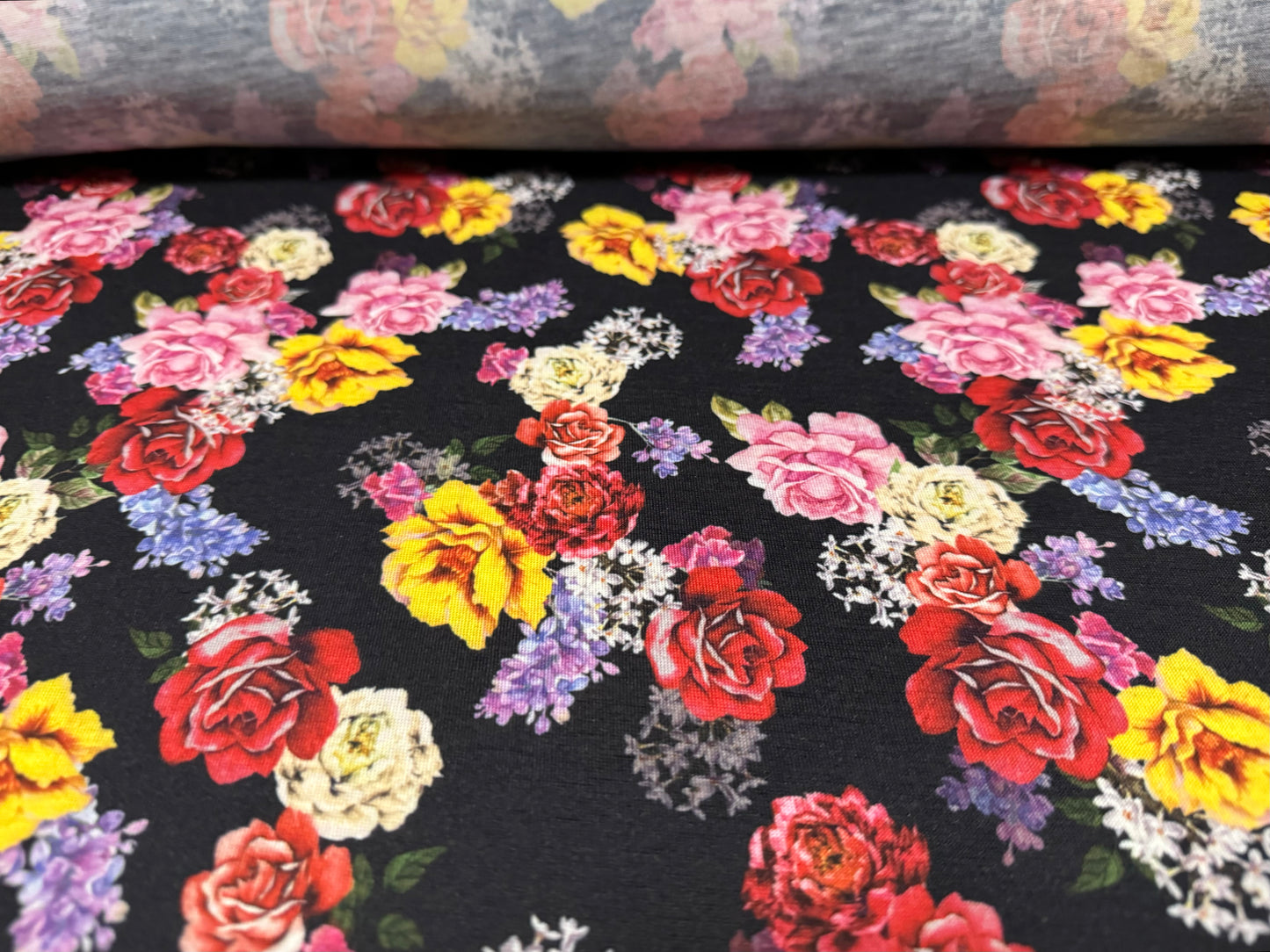 Soft handle single jersey fabric, per metre - roses print - black with multicolour flowers