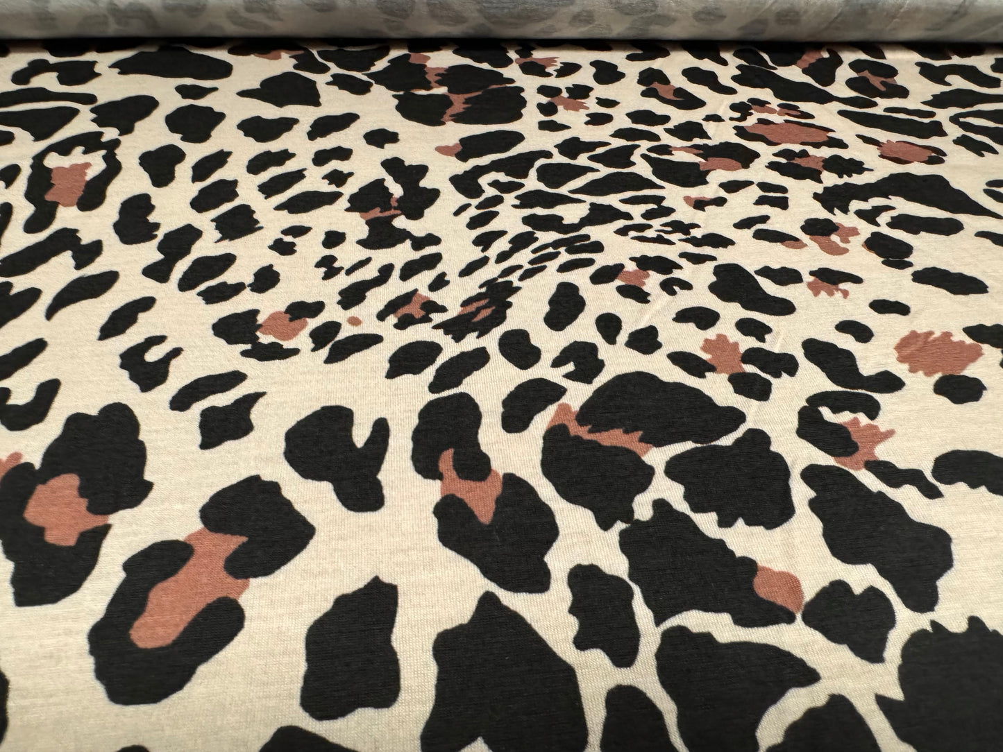 Soft handle stretch single jersey fashion fabric, per metre - stylised leopard print - dark cream